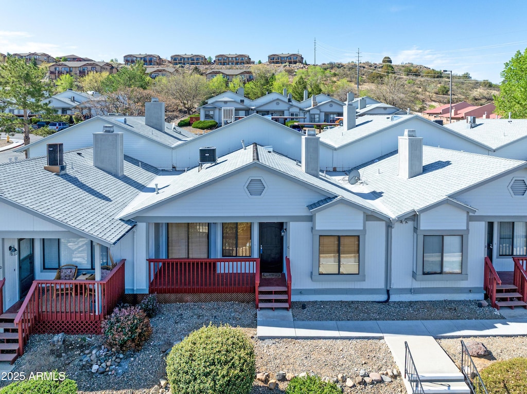 3069 Tetons Ct Unit C9, Prescott, AZ 86301 - view of front of home featuring a porch, a residential view, and a chimney