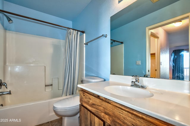 full bath with toilet, tile patterned floors, shower / bath combo, and vanity