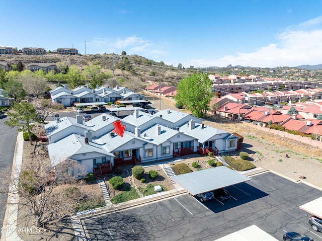 birds eye view of property with a mountain view and a residential view