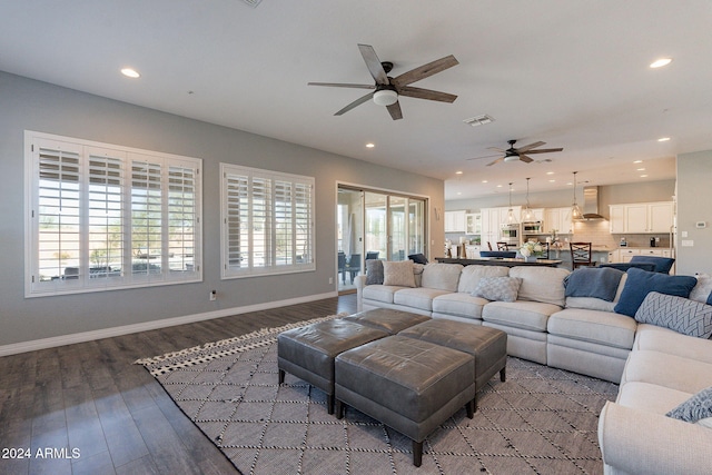 living room with ceiling fan and wood-type flooring