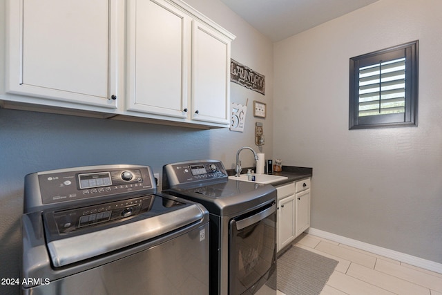 clothes washing area with separate washer and dryer, sink, light tile patterned floors, and cabinets