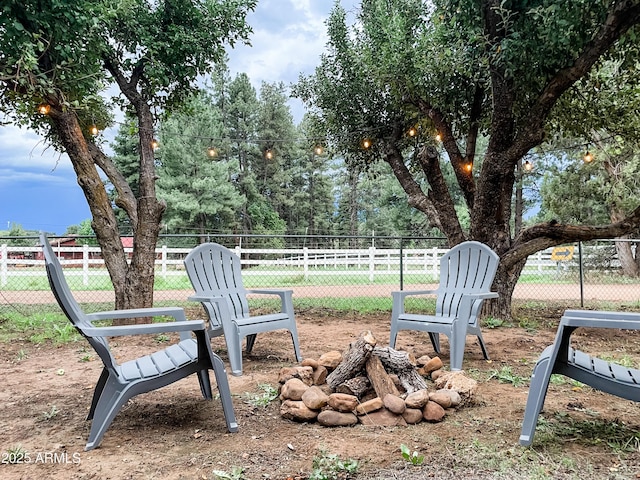 view of yard with a fire pit