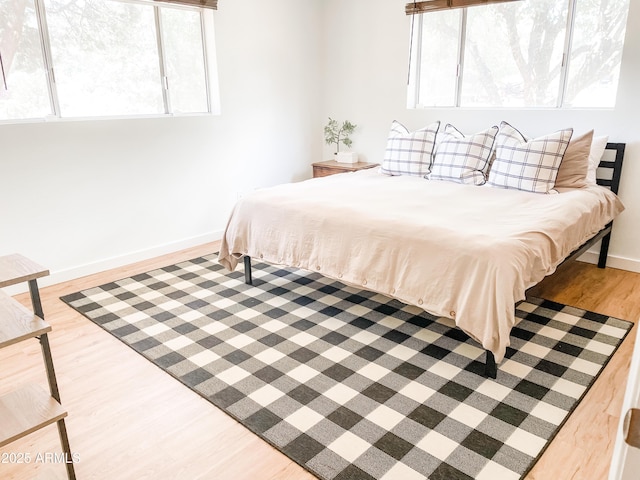 bedroom with hardwood / wood-style flooring