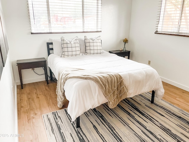 bedroom with wood-type flooring