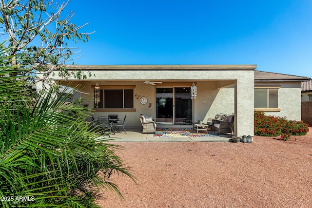 back of house featuring ceiling fan, a patio, and stucco siding