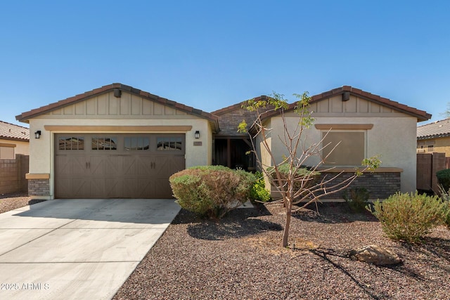 view of front facade with stucco siding, concrete driveway, and an attached garage