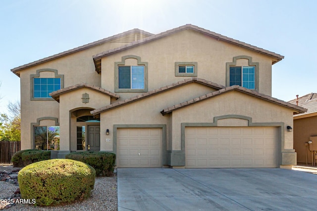 mediterranean / spanish-style home with a garage