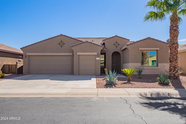 42915 W Kingfisher Dr, Maricopa, AZ 85138 - mediterranean / spanish home with stucco siding, a tile roof, concrete driveway, and a garage