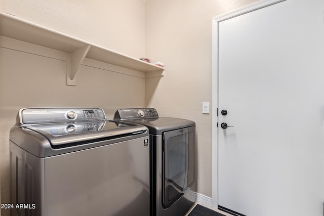 laundry area featuring washing machine and clothes dryer