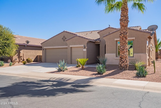 42915 W Kingfisher Dr, Maricopa, AZ 85138 - view of front of property with stucco siding, concrete driveway, a tiled roof, and a garage