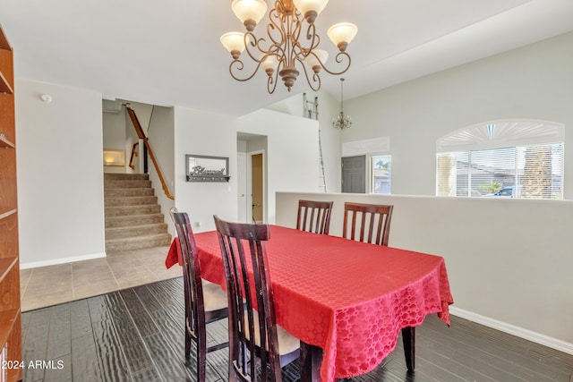 dining space with a chandelier and hardwood / wood-style flooring