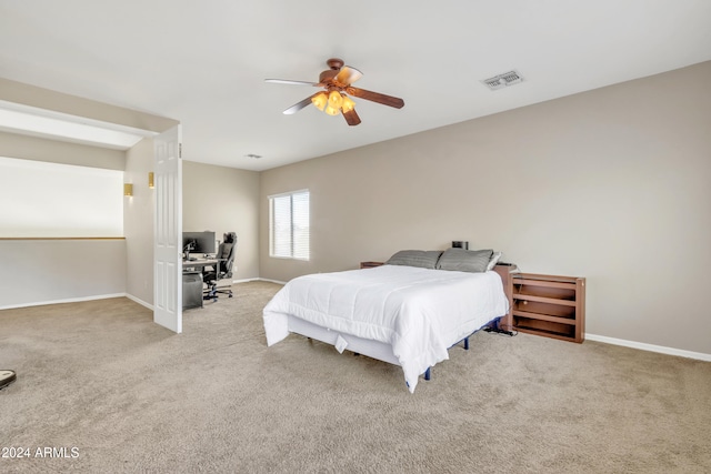 bedroom featuring light carpet and ceiling fan