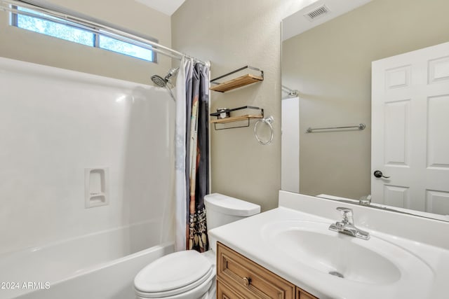 full bathroom with shower / tub combo, vanity, and toilet