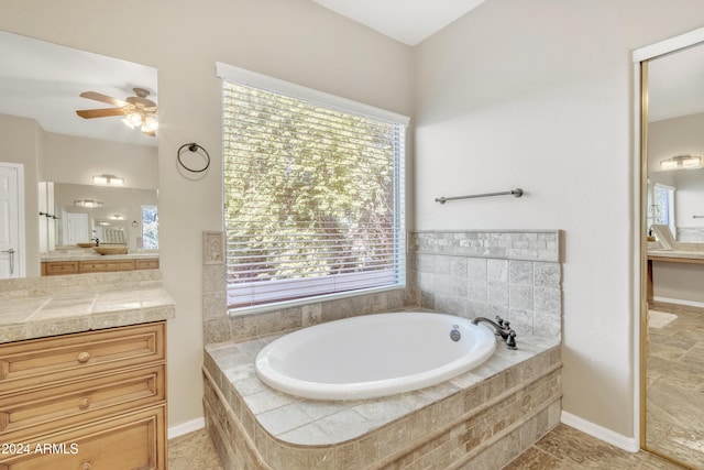 14462 W Avalon Dr, Goodyear, AZ 85395 - full bath with a ceiling fan, a garden tub, and vanity