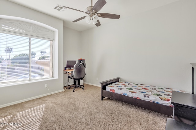 carpeted bedroom with ceiling fan