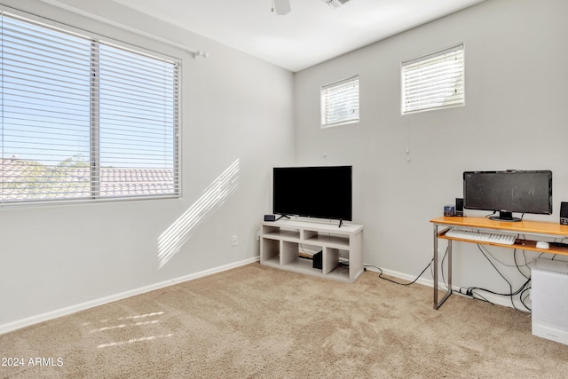 carpeted home office with ceiling fan