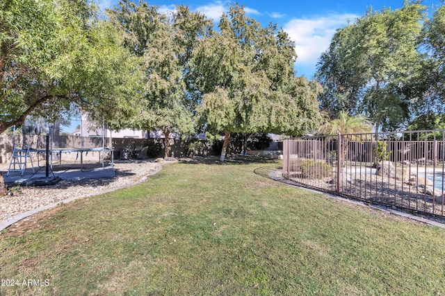 14462 W Avalon Dr, Goodyear, AZ 85395 - fenced backyard with a trampoline