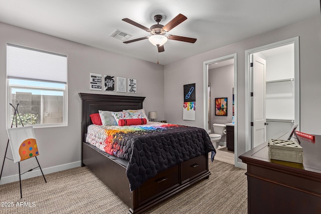 bedroom featuring ensuite bath and ceiling fan