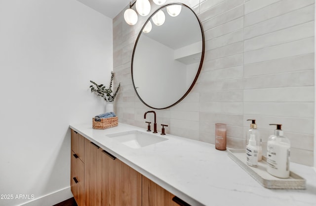 bathroom featuring tasteful backsplash and vanity