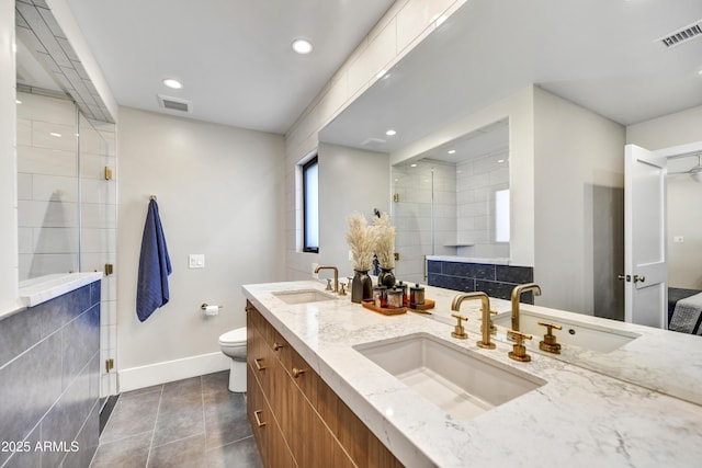 bathroom featuring a sink and visible vents