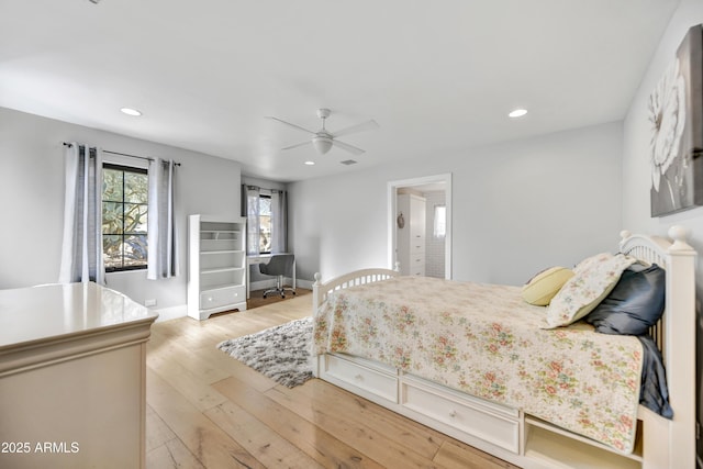 bedroom featuring a ceiling fan, recessed lighting, light wood-type flooring, and baseboards