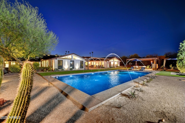 outdoor pool featuring a pergola and a patio