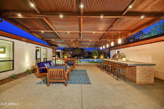 view of patio with outdoor lounge area and outdoor wet bar