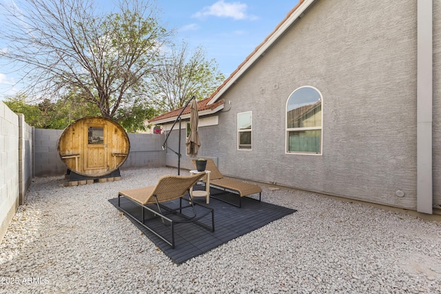 view of patio featuring a fenced backyard and a gate