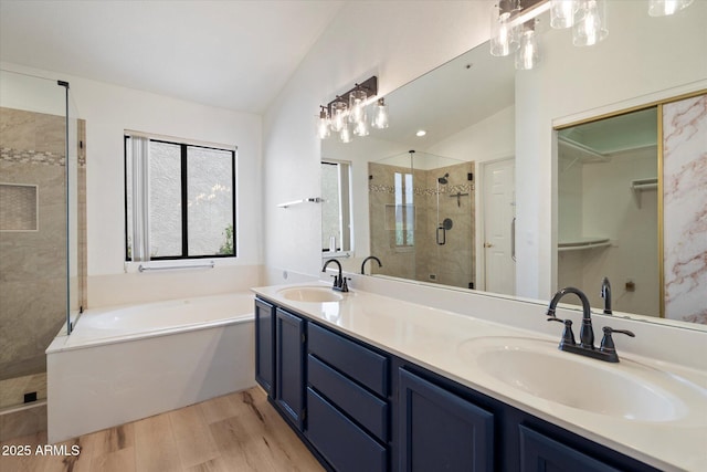 7565 N Via De La Siesta, Scottsdale, AZ 85258 - full bath featuring wood finished floors, a stall shower, a bath, lofted ceiling, and double vanity