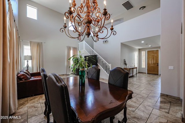 3088 E Andre Ave, Gilbert, AZ 85298 - dining room with a high ceiling, a chandelier, stairs, and baseboards