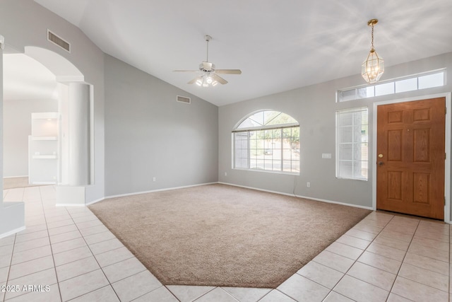 21 E Irvine Rd, Phoenix, AZ 85086 - entrance foyer featuring light carpet, light tile patterned flooring, a ceiling fan, arched walkways, and high vaulted ceiling