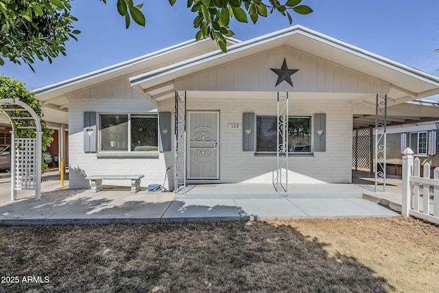 120 S Olive, Mesa, AZ 85204 - view of front of home with brick siding and a porch