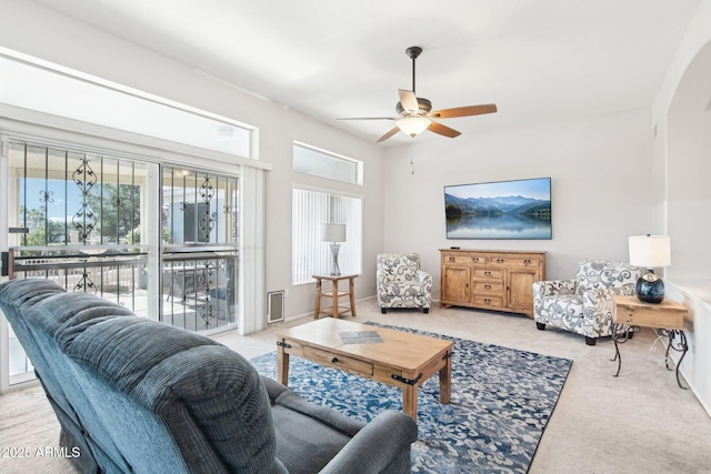 living room with light carpet and ceiling fan