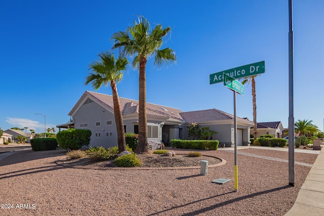 view of front of property with a garage