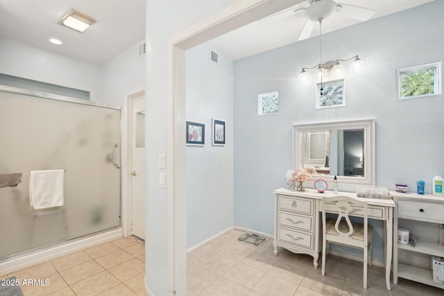 bathroom featuring an enclosed shower, tile patterned floors, and ceiling fan