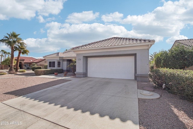 mediterranean / spanish house featuring a garage