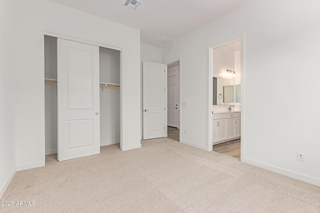 21952 E Saddle Ct E, Queen Creek, AZ 85142 - unfurnished bedroom with carpet floors, baseboards, a closet, and a sink