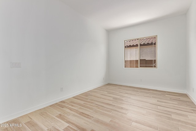 21952 E Saddle Ct E, Queen Creek, AZ 85142 - spare room featuring light wood-style floors and baseboards