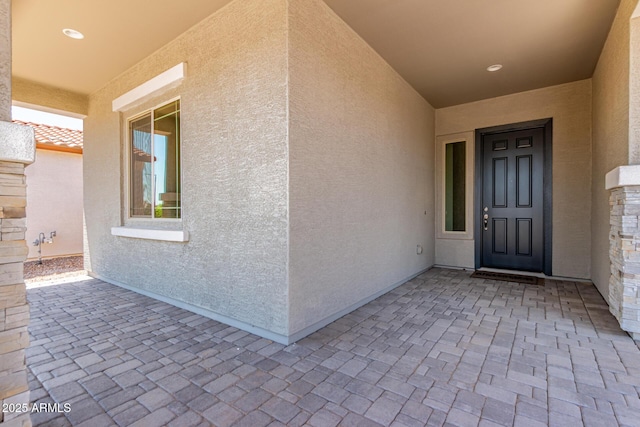 21952 E Saddle Ct E, Queen Creek, AZ 85142 - entrance to property featuring stucco siding and a patio