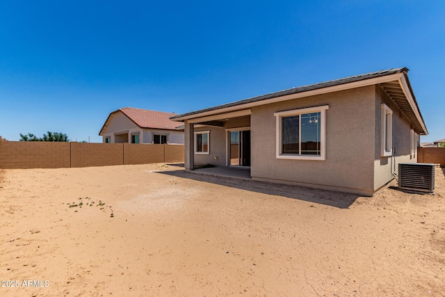 21952 E Saddle Ct E, Queen Creek, AZ 85142 - back of property with central AC, a fenced backyard, a patio area, and stucco siding