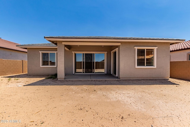 21952 E Saddle Ct E, Queen Creek, AZ 85142 - rear view of house with a fenced backyard, a patio area, and stucco siding