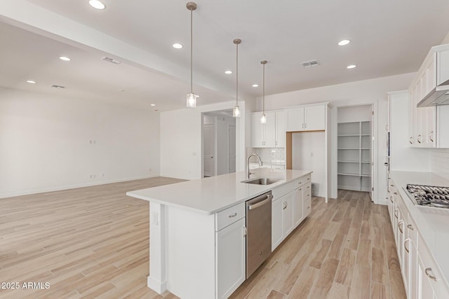 21952 E Saddle Ct E, Queen Creek, AZ 85142 - kitchen featuring a sink, appliances with stainless steel finishes, decorative backsplash, light wood-type flooring, and recessed lighting