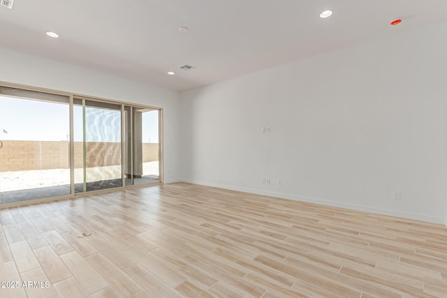 21952 E Saddle Ct E, Queen Creek, AZ 85142 - unfurnished room with light wood-type flooring, baseboards, and recessed lighting