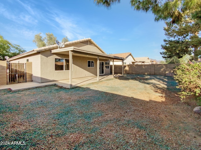 back of property featuring a patio area