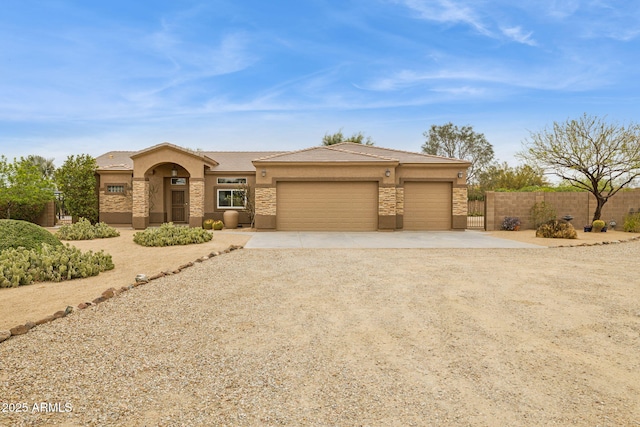 39520 N 1st St, Phoenix, AZ 85086 - view of front facade featuring stucco siding, fence, a tiled roof, driveway, and a garage