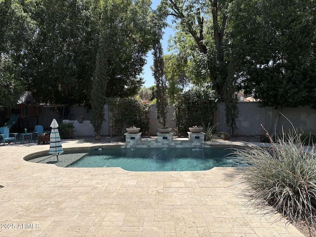 view of pool featuring a fenced in pool, a patio area, and a fenced backyard