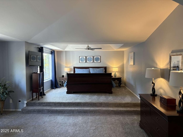 carpeted bedroom with baseboards and a ceiling fan