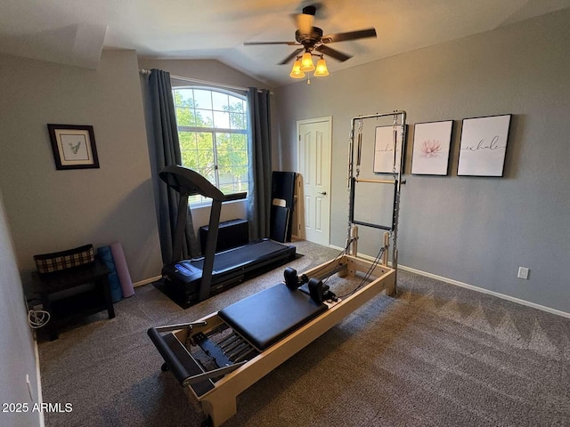 workout room featuring baseboards, vaulted ceiling, a ceiling fan, and carpet