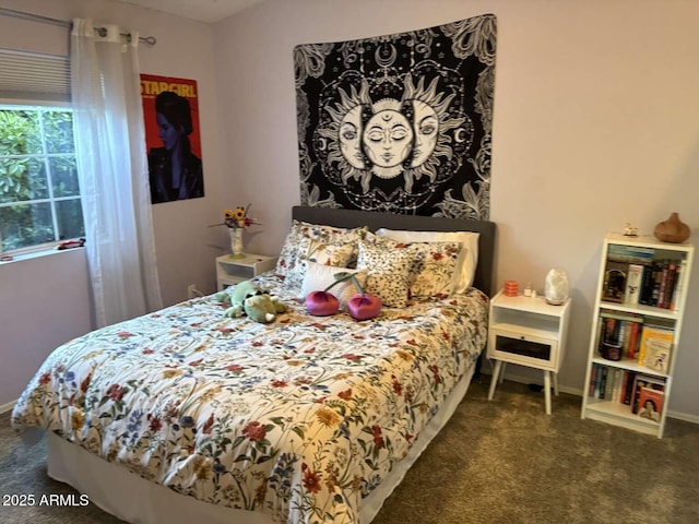 carpeted bedroom with baseboards