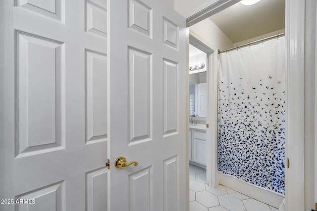 bathroom featuring vanity, a shower with curtain, and tile patterned flooring